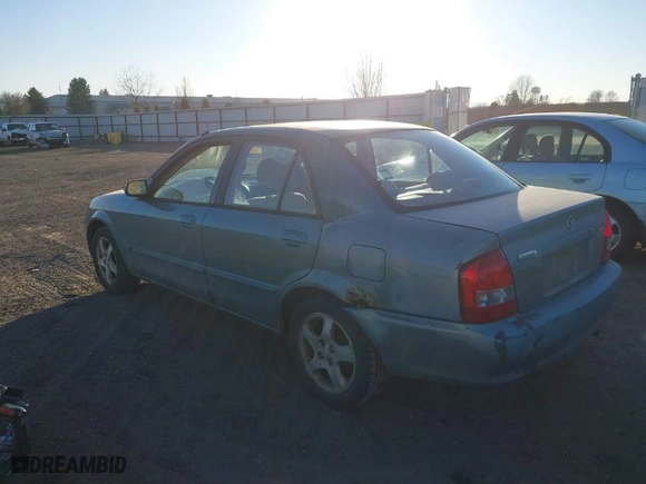 2001 Mazda Protege LX with VIN JM1BJ225310479705, listed as a IAAI auction lot 41456334 with 203,268 mi miles. Bid and sale history available at carsss.com. Image 3.