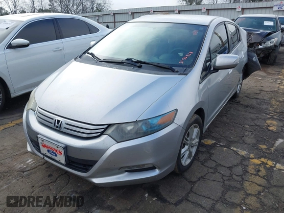 2010 Honda Insight EX with VIN JHMZE2H77AS022538, listed as a IAAI auction lot 41804579 with 184,000 mi miles and . Bid and sale history available at DreamBid. Image 2.