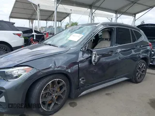 2021 BMW X1 xDrive28i with VIN WBXJG9C03M3M80011, listed as a IAAI auction lot 42137781 with 132,969 mi miles. Bid and sale history available at carsss.com. Image 14.