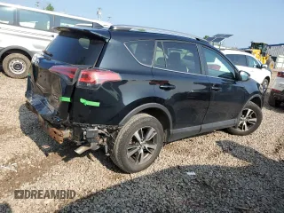 2018 Toyota RAV4 XLE with VIN 2T3RFREV0JW765995, listed as a Copart auction lot 63968785 with 114,598 mi miles and Salvage title. Bid and sale history available at DreamBid. Image 3.