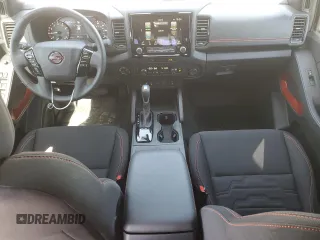 2023 Nissan Frontier Pro-4X with VIN 1N6ED1EK0PN668109, listed as a Copart auction lot 57064975 with 6,406 mi miles and Salvage title. Bid and sale history available at DreamBid. Image 8.