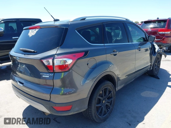 2017 Ford Escape Titanium with VIN 1FMCU0J97HUE07747, listed as a IAAI auction lot 41977788 with 104,560 mi miles. Bid and sale history available at carsss.com. Image 4.