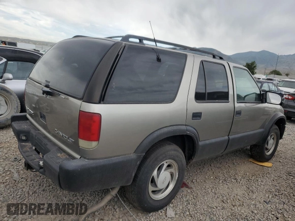 1999 Chevrolet Blazer Trailblazer z VIN 1GNDT13W9X2238417, wystawiony jako Copart lot #80087223 z przebiegiem Nie podano mil oraz Szkoda całkowita • Salvage title. Historia ofert i sprzedaży dostępna na DreamBid. Obrazek 3.