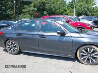 2023 Honda Civic EX with VIN 2HGFE1F75PH302414, listed as a IAAI auction lot 42680807 with 49,520 mi miles and . Bid and sale history available at DreamBid. Image 13.