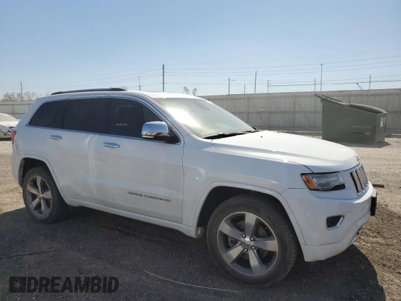 2014 Jeep Grand Cherokee Overland with VIN 1C4RJFCT7EC105296, listed as a Copart auction lot 50822775 with 180,067 mi miles and Salvage Title. Bid and sale history available at DreamBid. Image 4.