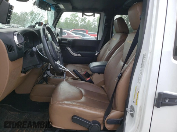 2013 Jeep Wrangler Unlimited Sahara with VIN 1C4HJWEG9DL628684, listed as a Copart auction lot 57672175 with 69,010 mi miles and Salvage title. Bid and sale history available at DreamBid. Image 7.