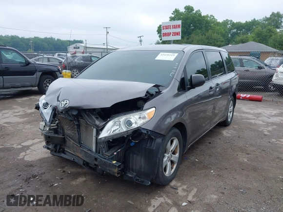 2014 Toyota Sienna L with VIN 5TDZK3DC5ES439593, listed as a IAAI auction lot 42420219 with 136,544 mi miles and . Bid and sale history available at DreamBid. Image 6.