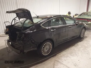 2016 Ford Fusion Titanium with VIN 3FA6P0K96GR197709, listed as a IAAI auction lot 40977902 with 135,259 mi miles. Bid and sale history available at carsss.com. Image 4.