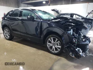 2023 Mazda CX-30 S Premium with VIN 3MVDMBDM0PM520591, listed as a Copart auction lot 48178215 with 9,999 mi miles and Salvage Title. Bid and sale history available at DreamBid. Image 4.