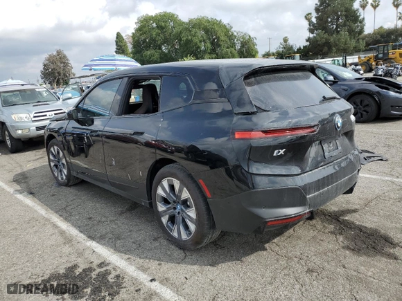 2025 BMW iX xDrive50 with VIN WB523CF00SCT18853, listed as a Copart auction lot 51282705 with 0 mi miles and Salvage Title. Bid and sale history available at carsss.com. Image 2.