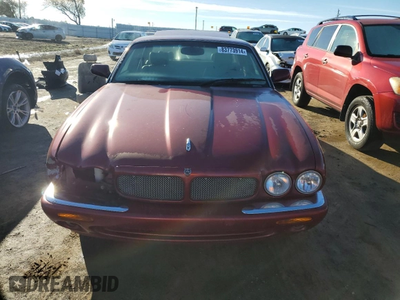 1999 Jaguar XJ with VIN SAJPX1849XC857869, listed as a Copart auction lot 83773914 with 172,496 mi miles and Clean title. Bid and sale history available at DreamBid. Image 5.