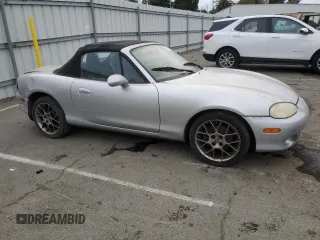2004 Mazda MX-5 Miata LS with VIN JM1NB353440402453, listed as a Copart auction lot 45064475 with 151,508 mi miles and Salvage title. Bid and sale history available at DreamBid. Image 4.