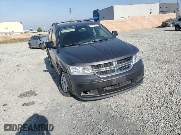 2014 Dodge Journey American Value with VIN 3C4PDCABXET277897, listed as a Copart auction lot 60566735 with 113,343 mi miles and Salvage title. Bid and sale history available at DreamBid. Image 14.