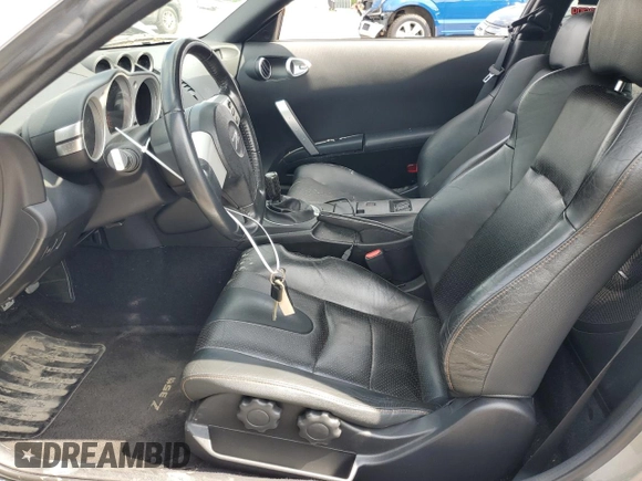 2005 Nissan 350Z with VIN JN1AZ34D65M610383, listed as a Copart auction lot 63184204 with 66,806 mi miles and Salvage Title. Bid and sale history available at DreamBid. Image 7.