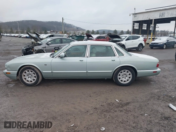1998 Jaguar XJ with VIN SAJHN1242WC819689, listed as a IAAI auction lot 41148530 with 60,143 mi miles and . Bid and sale history available at DreamBid. Image 14.