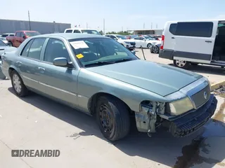 2005 Mercury Grand Marquis LS Premium z VIN 2MEFM75W55X643620, wystawiony jako IAAI lot #41830255 z przebiegiem 217 982 mil mil oraz . Historia ofert i sprzedaży dostępna na DreamBid. Obrazek 1.