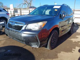 2015 Subaru Forester 2.0XT Premium with VIN JF2SJGDC2FH532994, listed as a IAAI auction lot 41797117 with 104,571 mi miles. Bid and sale history available at carsss.com. Image 2.