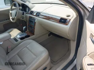 2005 Ford Five Hundred Limited with VIN 1FAHP25175G135427, listed as a IAAI auction lot 42383896 with 299,427 mi miles and . Bid and sale history available at DreamBid. Image 5.