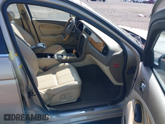 2005 Jaguar S-Type with VIN SAJWA01T95FN22745, listed as a IAAI auction lot 41898269 with 57,614 mi miles and . Bid and sale history available at DreamBid. Image 5.