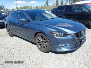 2016 Mazda Mazda6 i Grand Touring with VIN JM1GJ1W51G1436977, listed as a IAAI auction lot 42097363 with 128,941 mi miles. Bid and sale history available at carsss.com. Image 1.