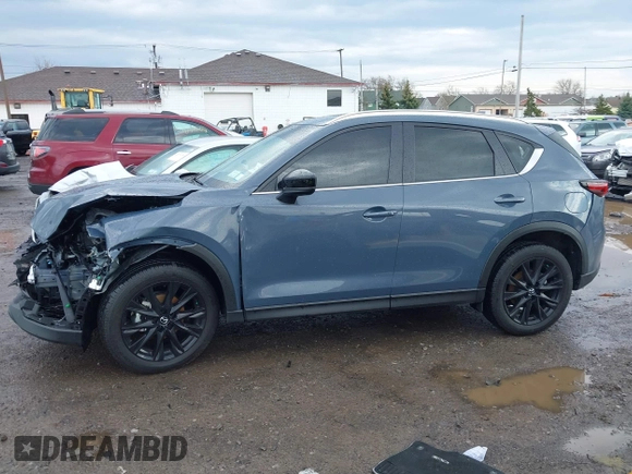2024 Mazda CX-5 S Carbon Edition z VIN JM3KFBCL1R0470051, wystawiony jako IAAI lot #42088186 z przebiegiem 10 285 mil mil oraz . Historia ofert i sprzedaży dostępna na DreamBid. Obrazek 14.