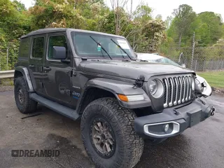 2021 Jeep Wrangler Unlimited Sahara z VIN 1C4JJXP60MW704738, wystawiony jako IAAI lot #42042079 z przebiegiem 63 765 mil mil oraz . Historia ofert i sprzedaży dostępna na DreamBid. Obrazek 1.