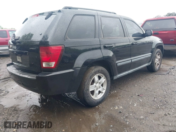 2007 Jeep Grand Cherokee Laredo with VIN 1J8GS48K57C516037, listed as a IAAI auction lot 41982692 with 273,961 mi miles. Bid and sale history available at carsss.com. Image 4.