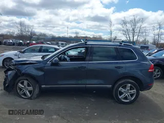 2013 Volkswagen Touareg Lux with VIN WVGEF9BP4DD006851, listed as a IAAI auction lot 41983791 with 115,551 mi miles and . Bid and sale history available at DreamBid. Image 13.