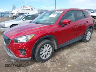 2014 Mazda CX-5 Touring with VIN JM3KE2CY3E0355296, listed as a IAAI auction lot 41688625 with 164,390 mi miles. Bid and sale history available at carsss.com. Image 2.