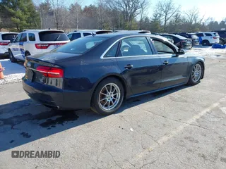 2017 Audi A8 L Sport with VIN WAU43AFDXHN003685, listed as a IAAI auction lot 41264314 with 114,828 mi miles. Bid and sale history available at carsss.com. Image 4.