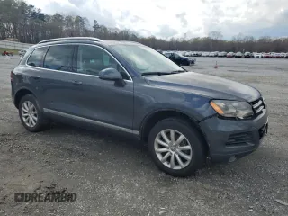 2012 Volkswagen Touareg Sport with VIN WVGEK9BP7CD006059, listed as a Copart auction lot 49411245 with 202,323 mi miles and Clean Title. Bid and sale history available at DreamBid. Image 4.