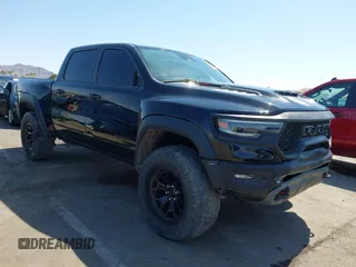 2022 Ram 1500 TRX with VIN 1C6SRFU99NN215579, listed as a IAAI auction lot 42475901 with 37,736 mi miles and . Bid and sale history available at DreamBid. Image 1.
