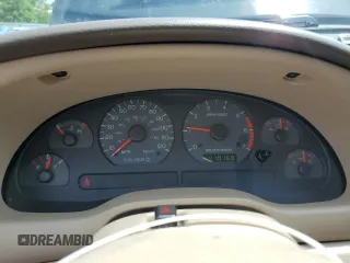 2001 Ford Mustang Deluxe z VIN 1FAFP44431F180282, wystawiony jako Copart lot #63592905 z przebiegiem 191 016 mil mil oraz Szkoda całkowita • Salvage title. Historia ofert i sprzedaży dostępna na DreamBid. Obrazek 9.