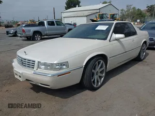 2002 Cadillac Eldorado ESC z VIN 1G6EL12Y92B100484, wystawiony jako IAAI lot #42418094 z przebiegiem 167 293 mil mil oraz . Historia ofert i sprzedaży dostępna na DreamBid. Obrazek 2.