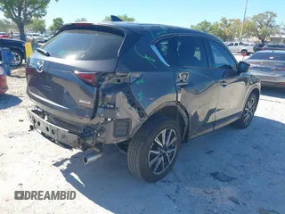 2018 Mazda CX-5 Grand Touring with VIN JM3KFBDM8J0314925, listed as a IAAI auction lot 41825917 with 70,027 mi miles. Bid and sale history available at carsss.com. Image 4.