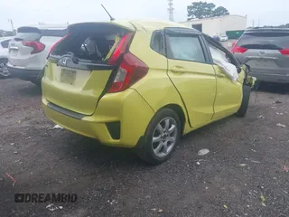 2015 Honda Fit LX z VIN 3HGGK5H5XFM734030, wystawiony jako IAAI lot #42596983 z przebiegiem 243 436 mil mil oraz . Historia ofert i sprzedaży dostępna na DreamBid. Obrazek 4.