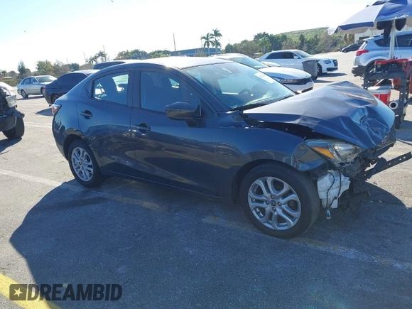2016 Scion iA with VIN 3MYDLBZV5GY142378, listed as a IAAI auction lot 41274960 with 123,807 mi miles. Bid and sale history available at carsss.com. Image 1.