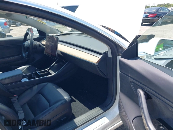 2018 Tesla Model 3 Long Range Battery with VIN 5YJ3E1EAXJF027179, listed as a IAAI auction lot 42059918 with 43,566 mi miles. Bid and sale history available at carsss.com. Image 5.