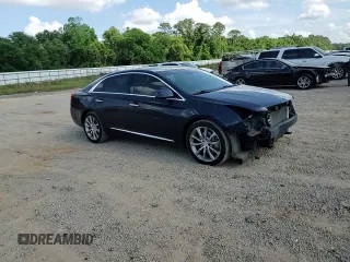 2015 Cadillac XTS Luxury z VIN 2G61M5S32F9169354, wystawiony jako Copart lot #54887215 z przebiegiem 138 795 mil mil oraz Szkoda całkowita • Salvage title. Historia ofert i sprzedaży dostępna na DreamBid. Obrazek 13.