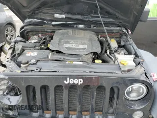 2015 Jeep Wrangler Unlimited Willys Wheeler with VIN 1C4BJWDG3FL601197, listed as a Copart auction lot 53832465 with 216,141 mi miles and Salvage Title. Bid and sale history available at DreamBid. Image 12.