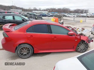 2016 Mitsubishi Lancer GT with VIN JA32U8FW1GU012988, listed as a IAAI auction lot 41498905 with 94,727 mi miles. Bid and sale history available at carsss.com. Image 12.
