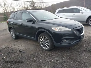 2015 Mazda CX-9 Grand Touring z VIN JM3TB3DV6F0464926, wystawiony jako IAAI lot #42035670 z przebiegiem 168 257 mil mil oraz . Historia ofert i sprzedaży dostępna na DreamBid. Obrazek 1.