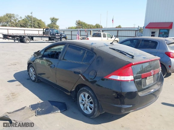 2010 Honda Insight EX with VIN JHMZE2H74AS036557, listed as a IAAI auction lot 41280150 with 110,310 mi miles. Bid and sale history available at carsss.com. Image 3.