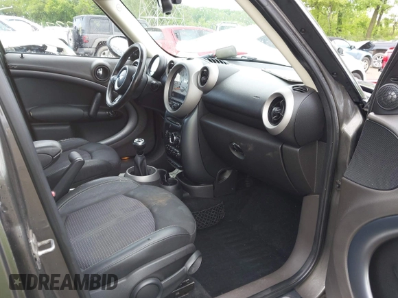 2011 MINI Countryman S with VIN WMWZC5C53BWM11022, listed as a IAAI auction lot 42249403 with 173,718 mi miles and . Bid and sale history available at DreamBid. Image 5.