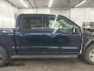 2023 Ford F-150 Lightning Pro with VIN 1FTVW1EL4PWG22900, listed as a IAAI auction lot 42139391 with 6,569 mi miles and . Bid and sale history available at DreamBid. Image 14.