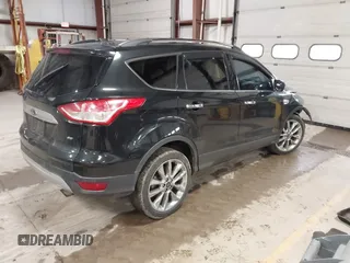 2015 Ford Escape SE with VIN 1FMCU9G9XFUA70029, listed as a IAAI auction lot 41673827 with 82,043 mi miles. Bid and sale history available at carsss.com. Image 4.