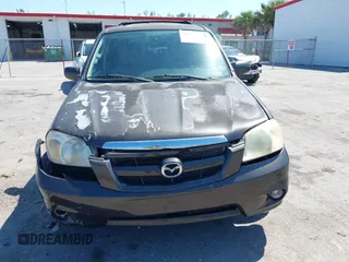2006 Mazda Tribute i with VIN 4F2YZ02Z36KM29148, listed as a IAAI auction lot 42044163 with 175,786 mi miles and . Bid and sale history available at carsss.com. Image 6.