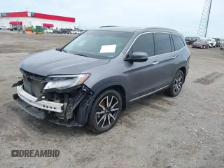 2019 Honda Pilot Touring 8-Passenger with VIN 5FNYF5H93KB028641, listed as a IAAI auction lot 42524078 with 56,744 mi miles and . Bid and sale history available at DreamBid. Image 20.
