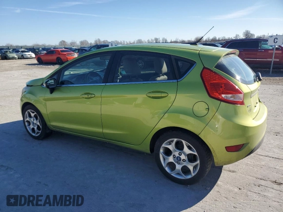 2011 Ford Fiesta SES with VIN 3FADP4FJ6BM132481, listed as a Copart auction lot 48028065 with 148,629 mi miles and Salvage Title. Bid and sale history available at carsss.com. Image 2.