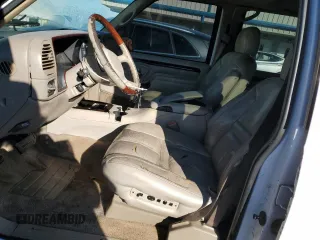 1999 Cadillac Escalade z VIN 1GYEK13R3XR406970, wystawiony jako Copart lot #87623365 z przebiegiem 189 339 mil mil oraz Szkoda całkowita • Salvage title. Historia ofert i sprzedaży dostępna na DreamBid. Obrazek 7.